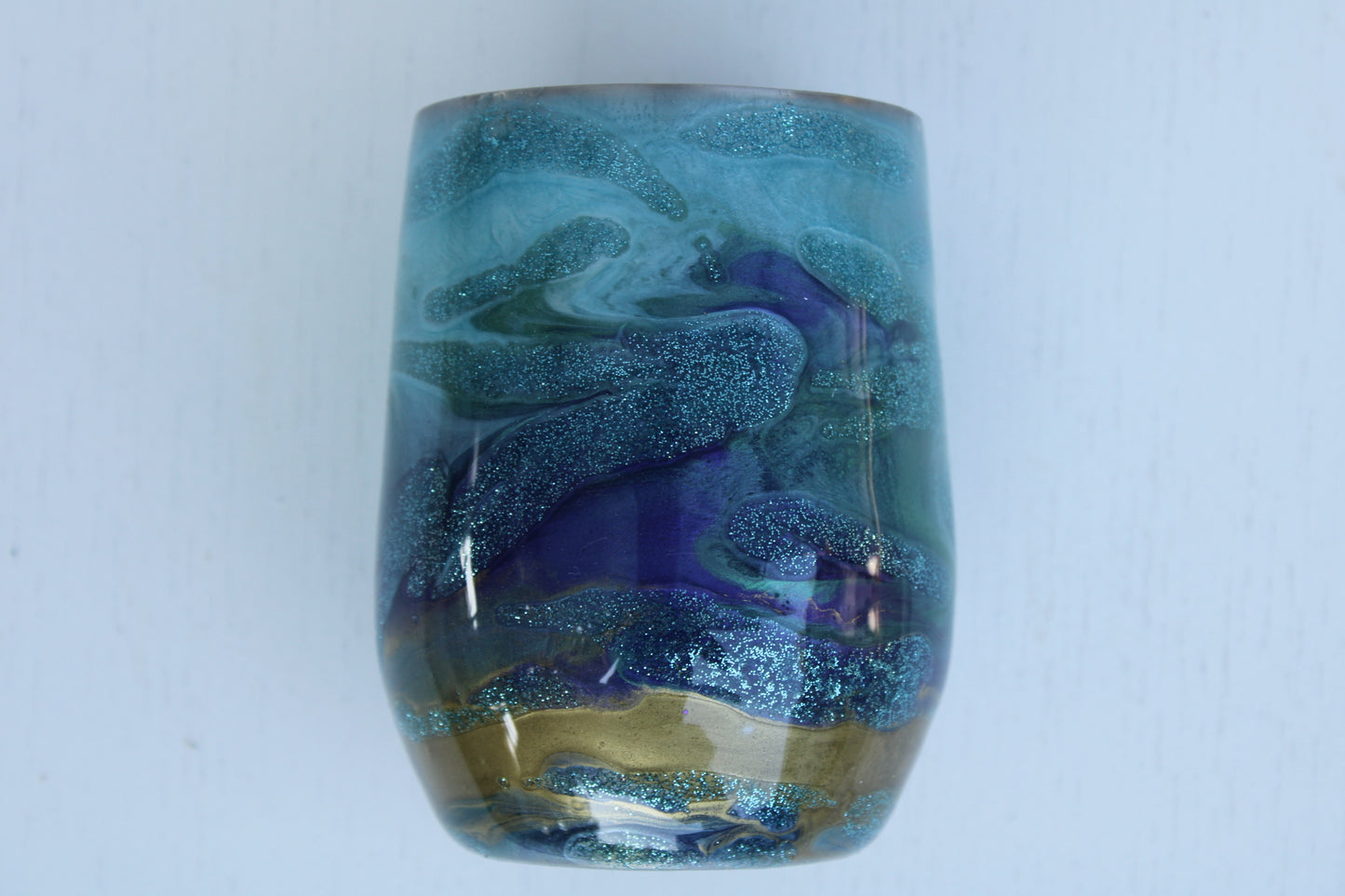 Tumbler Wine glass Stemless 12 ounce we've called (Blue Ghost). Stainless Steel cup painted and epoxied in layers of beautiful colors.