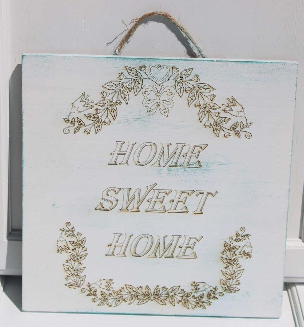 Sign that reads Home Sweet Home. 12x10x1 inches. Twine rope hanger. Painted rustic white