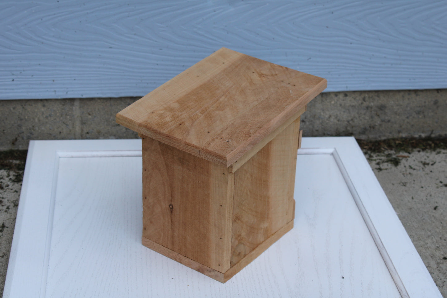 Bird House with an X pattern on front made from cedar