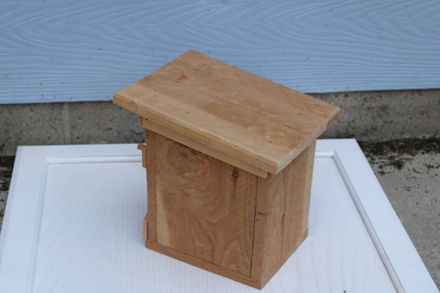 Bird House with an X pattern on front made from cedar