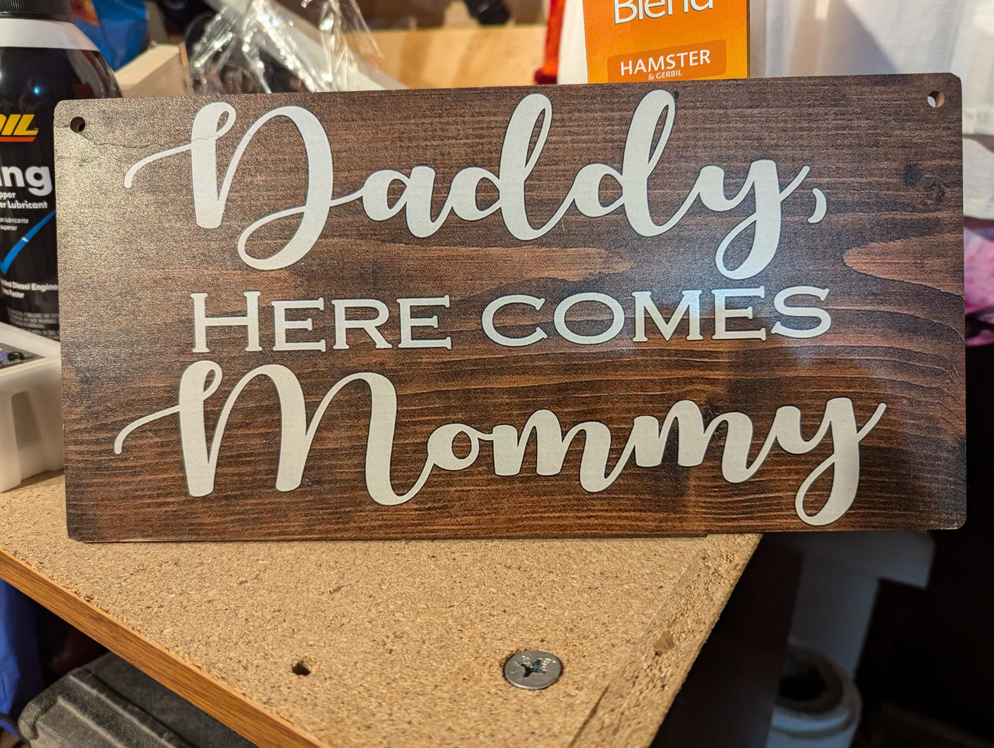 Sign wedding reads Daddy her comes Mommy