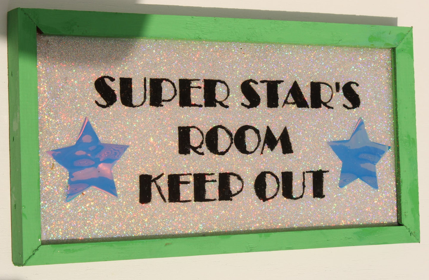 Decorative Sign that reads "Super Star's Room Keep Out" with glitter