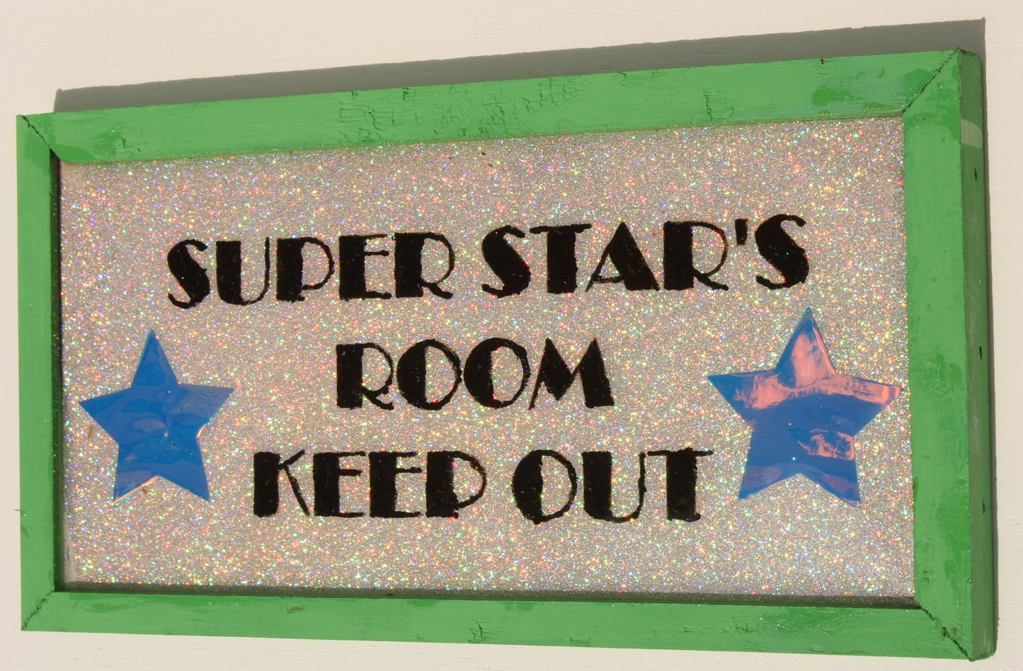 Decorative Sign that reads "Super Star's Room Keep Out" with glitter